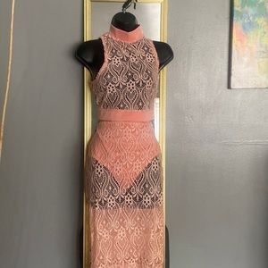 2 Piece Lace Set . Skirt comes with attached briefs . Crop top zipper back